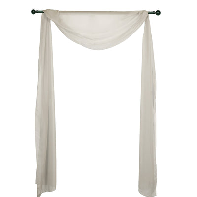 White sheer fabric draped on a green curtain rod