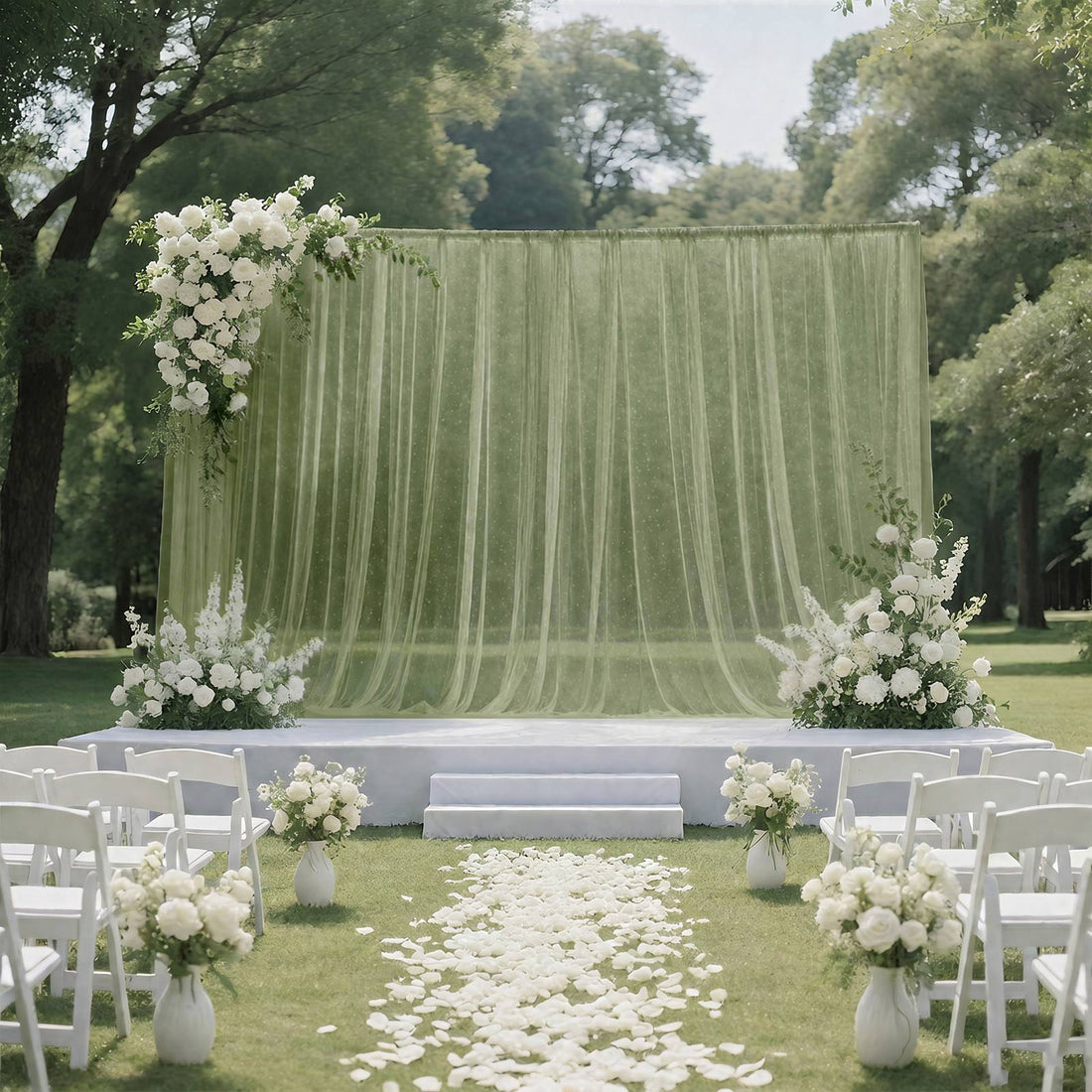 Elegant outdoor wedding ceremony setup with white floral arch and chairs