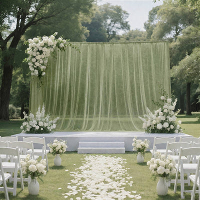Elegant outdoor wedding ceremony setup with white floral arch and chairs