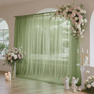 Green floral wedding backdrop with pink and white roses and candles