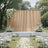 Elegant outdoor wedding ceremony setup with white flowers and gold backdrop