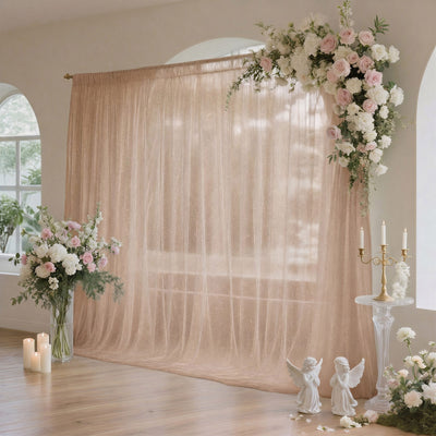 Elegant blush floral wedding backdrop with candles and angel decor