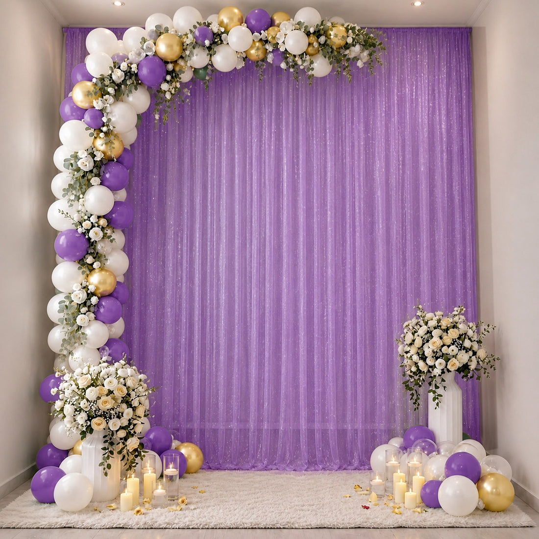 Purple, white and gold balloon arch with floral backdrop for elegant party decor