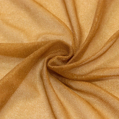 Golden shimmering fabric texture with elegant swirling folds#whtbkgd