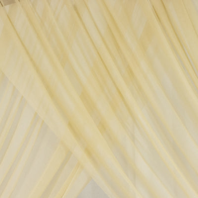 Sheer yellow curtains draped elegantly, adding warmth to any space. #whtbkgd