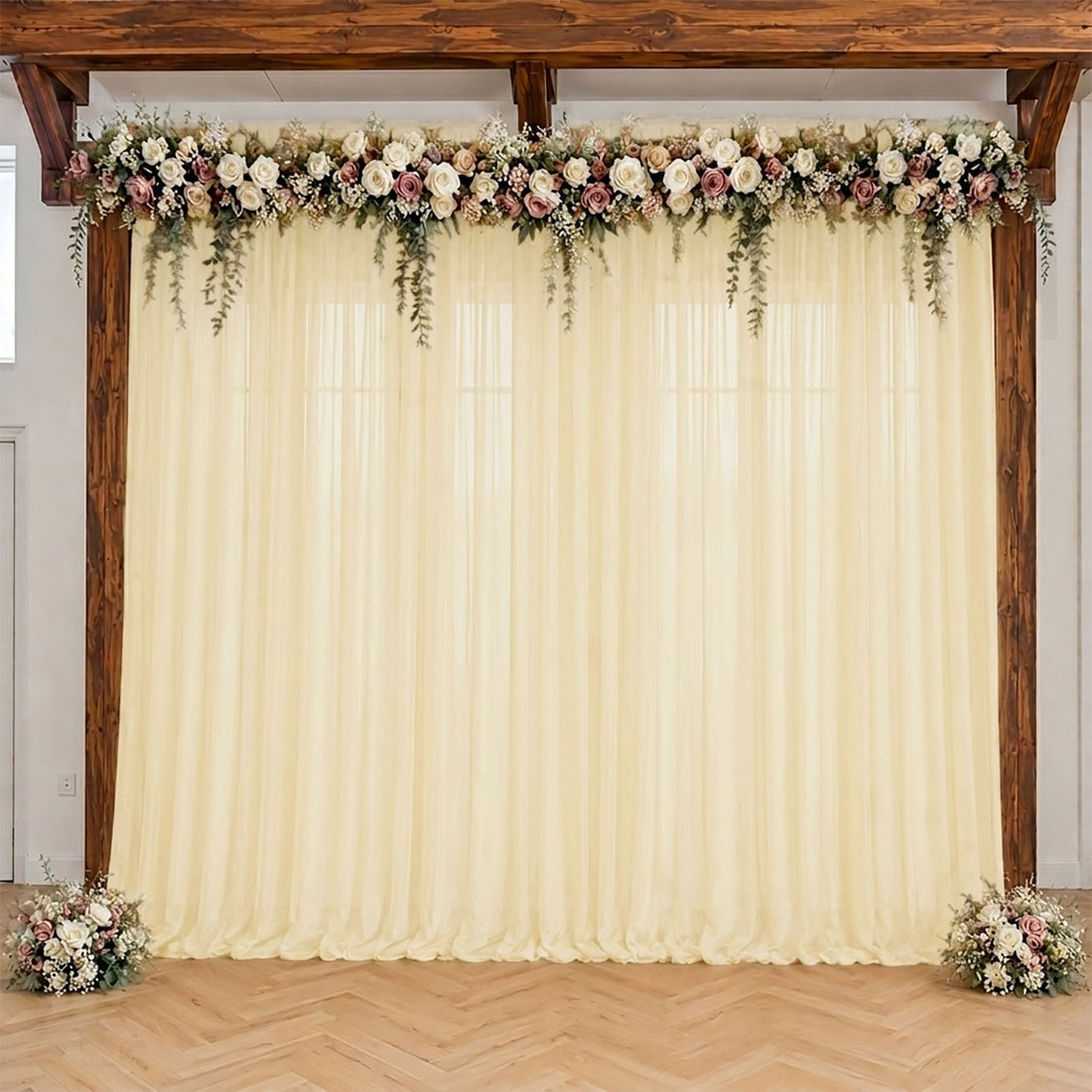 Floral wedding backdrop with wood frame and ivory drapes