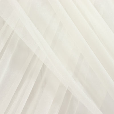 Sheer white fabric draped elegantly in soft folds.