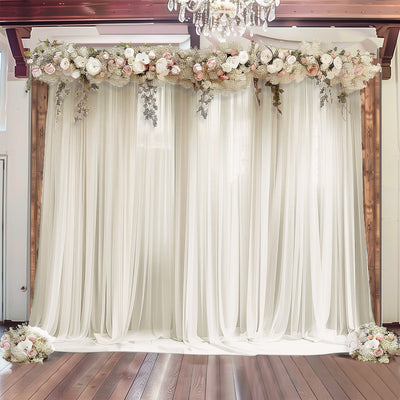 Elegant white drapery with floral arrangement for events and weddings.