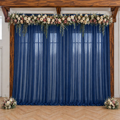 Blue wedding backdrop with floral garland and wooden arch frame