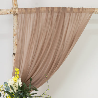 Brown sheer fabric draped elegantly with flowers below