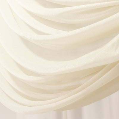 Elegant white draped fabric with shimmering texture.