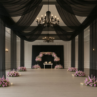 Elegant event space with floral arrangements and soft lighting.