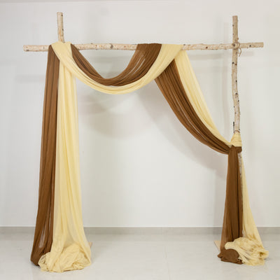 Decorative fabric drapery in brown and yellow hanging from a wooden frame