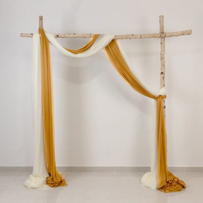 Rustic birch frame draped with white and gold fabric in minimalist decor