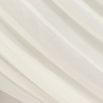 Sheer white fabric with subtle texture and soft draping.