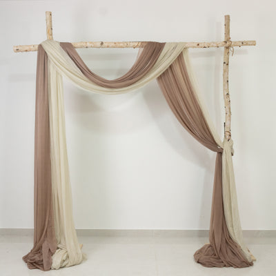 Decorative fabric draped on a rustic wooden frame for events or photography.