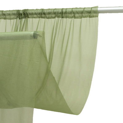 Sage green sheer curtain panel on rod