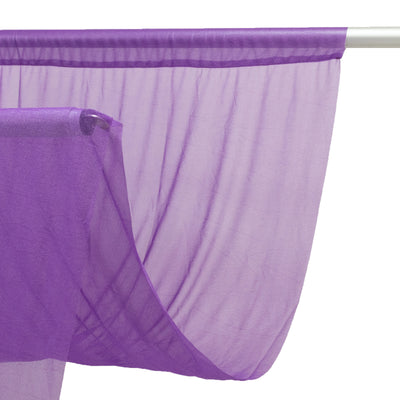 Purple sheer fabric draped elegantly on a rod.