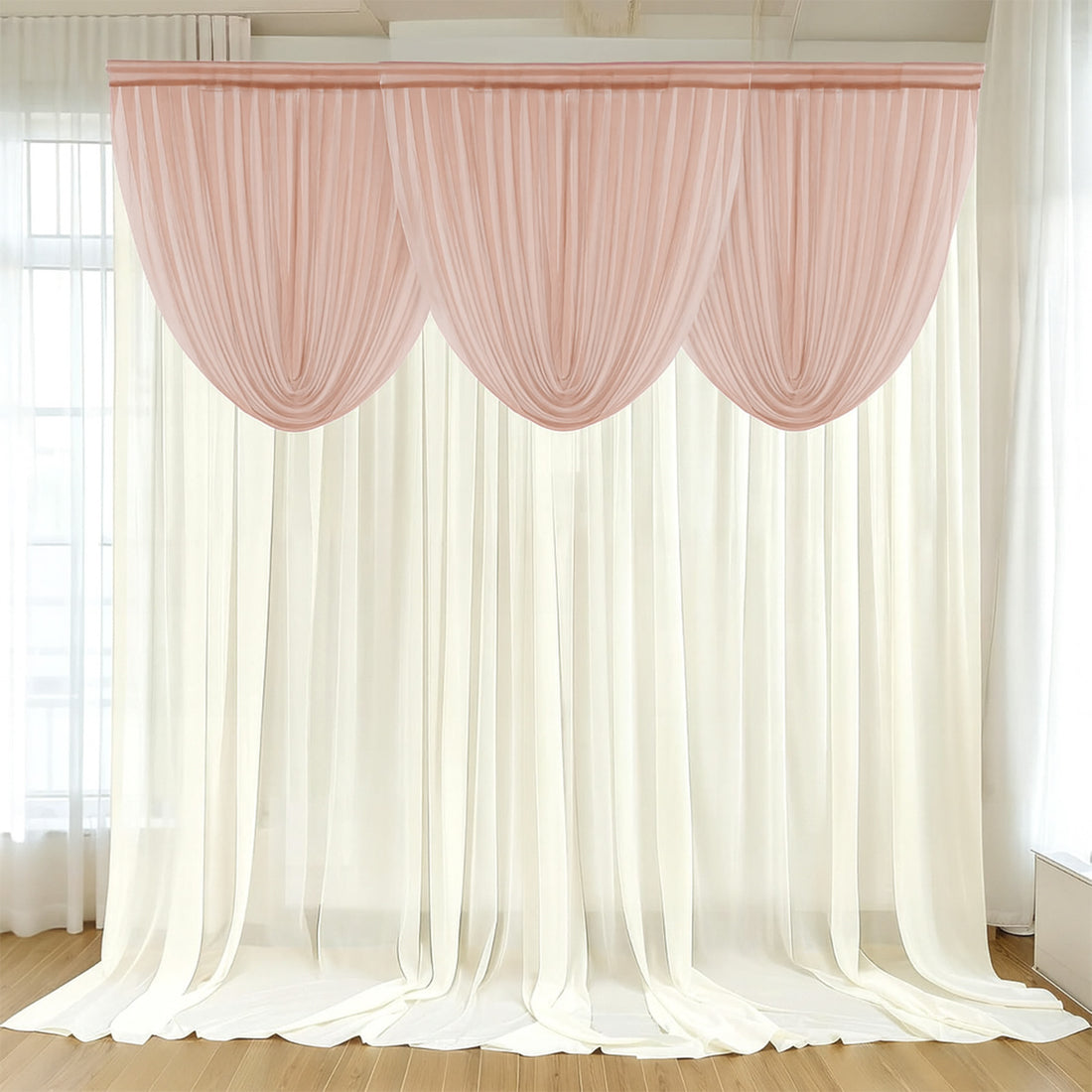 Elegant pink and white curtain set draped in a bright room.