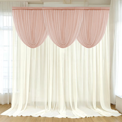 Elegant pink and white curtain set draped in a bright room.
