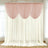 Elegant pink and white curtain set draped in a bright room.