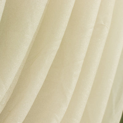 Sheer cream-colored fabric draped with soft folds and subtle shimmer.