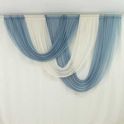 Blue and ivory sheer window drapes on display rod