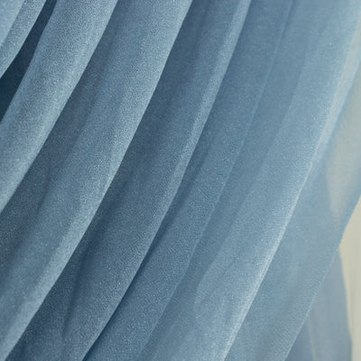 Blue sheer fabric with soft, flowing texture and gentle drapes.