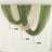 Elegant draped sheer curtains in soft beige and cream tones. 