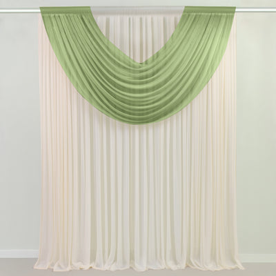 Green and ivory sheer curtains draped over a window rod