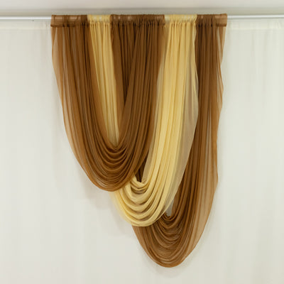 Layered brown and cream sheer drapes hanging on a curtain rod