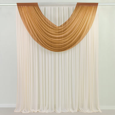 Brown sheer swag curtain panel draped on rod over white wall