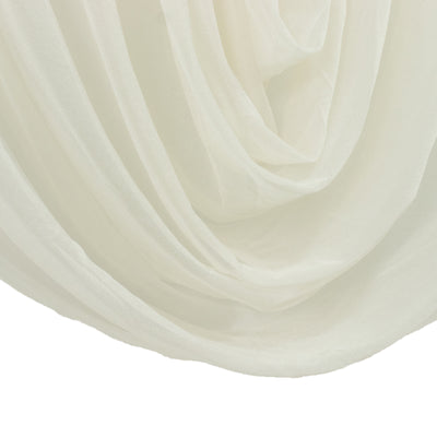 Layered sheer white drapery close-up