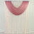 Ombre draped curtain in soft pink and cream tones 