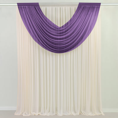 Purple sheer swag curtain over ivory panel on a rod
