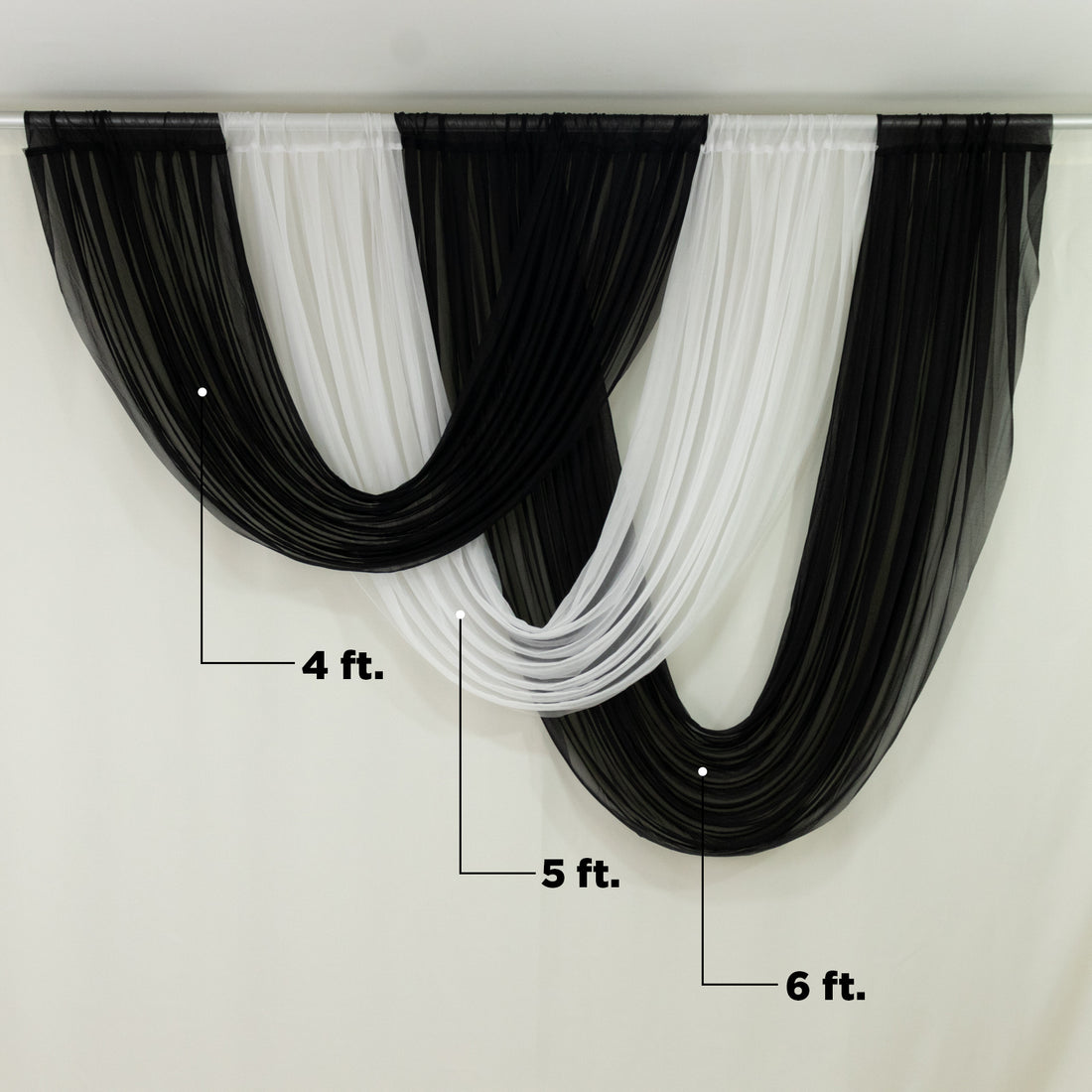 Draped black and white fabric curtain backdrop for events 