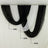 Draped black and white fabric curtain backdrop for events 