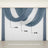 Blue and cream sheer curtain drapes elegantly arranged.