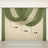 Elegant draped sheer curtains in green and beige tones.