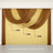 Draped fabric curtain in brown and yellow, showcasing elegant design.