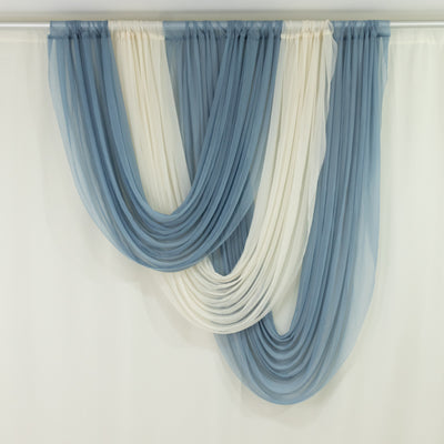 Blue and ivory sheer draped curtains on wall