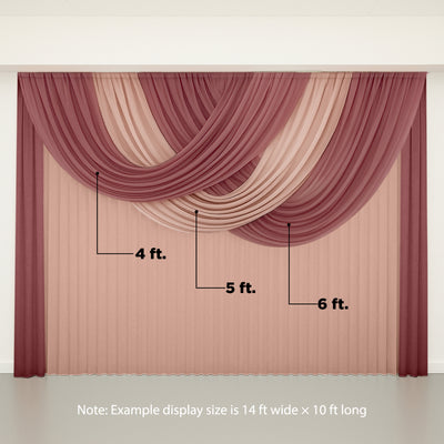 Layered drapery in shades of burgundy and blush hanging elegantly.