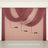 Layered drapery in shades of burgundy and blush hanging elegantly.