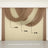 Draped fabric curtain display in brown and cream colors, showcasing elegant design.