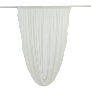 White sheer drapery fabric in a flowing design 