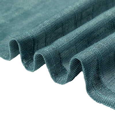 Textured teal fabric with soft drapes and waves.