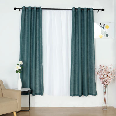 Teal sheer curtains draped on a window with a modern living room backdrop.