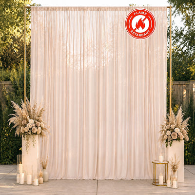 Elegant cream wedding backdrop with floral arrangements and candles, flame retardant