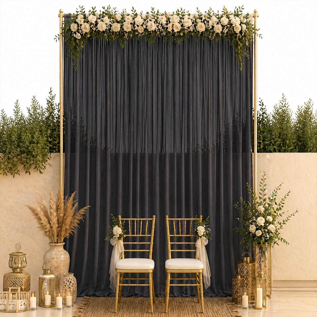 Elegant wedding photo backdrop with gold chairs, black drape, and white roses