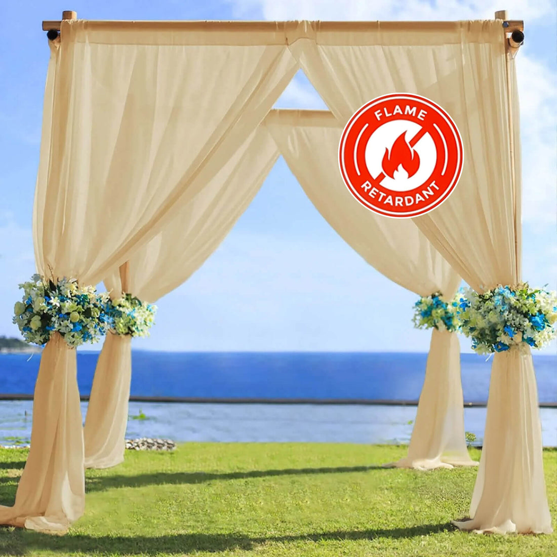 Flame retardant wedding arch with draped fabric and floral arrangements.